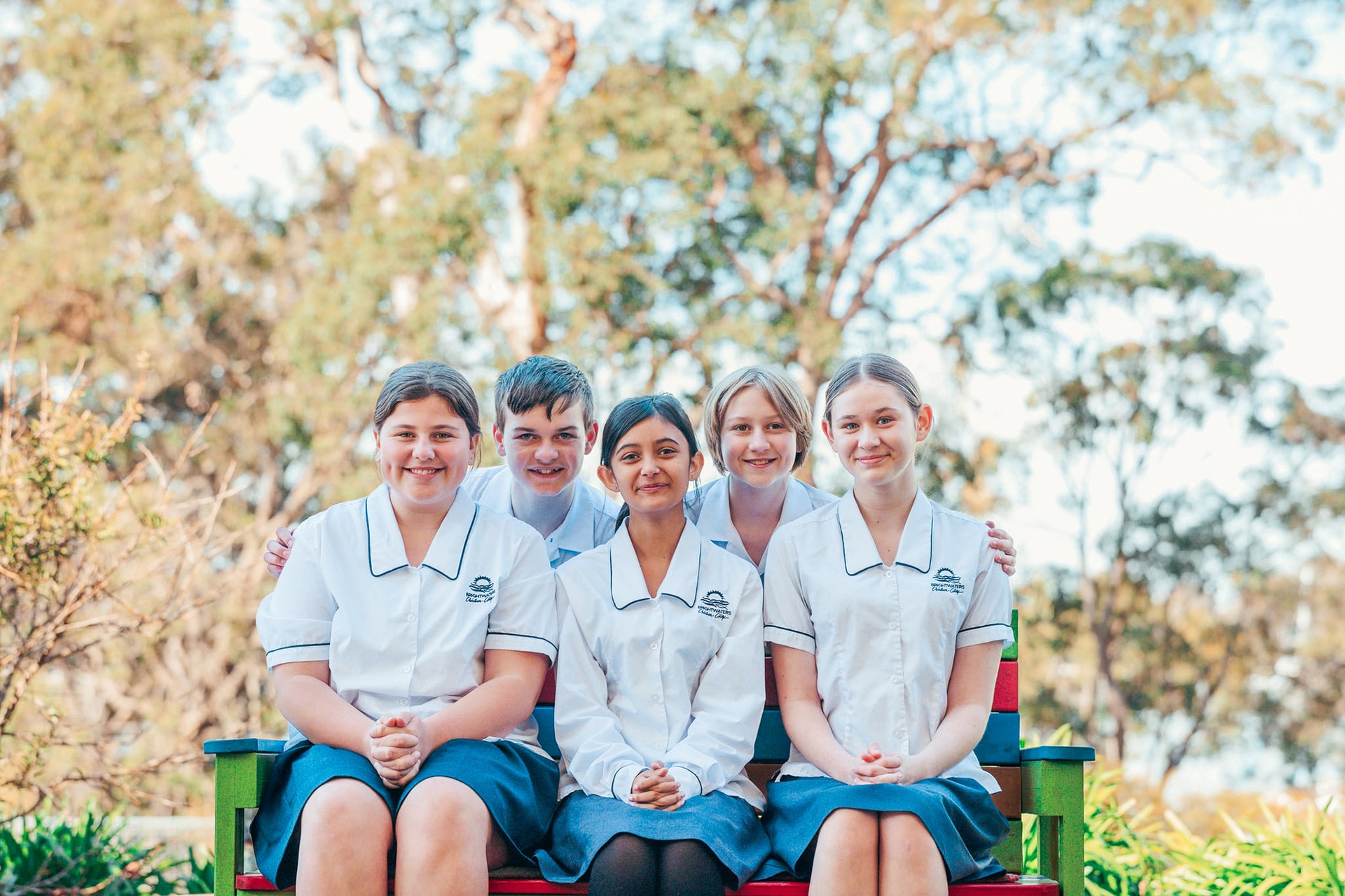 Group of friends in high school, sitting together, ready to learn