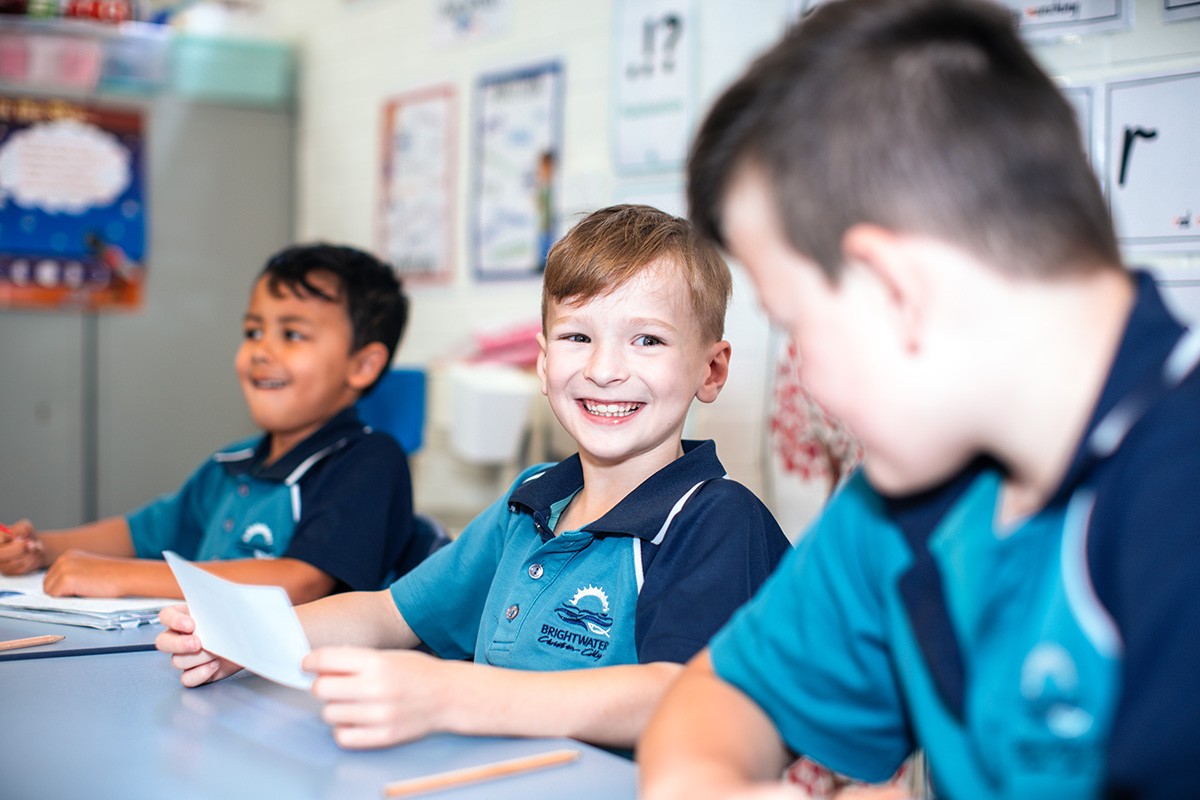 excited smiling primary school student