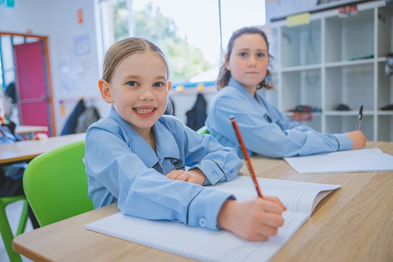 excited smiling primary school student